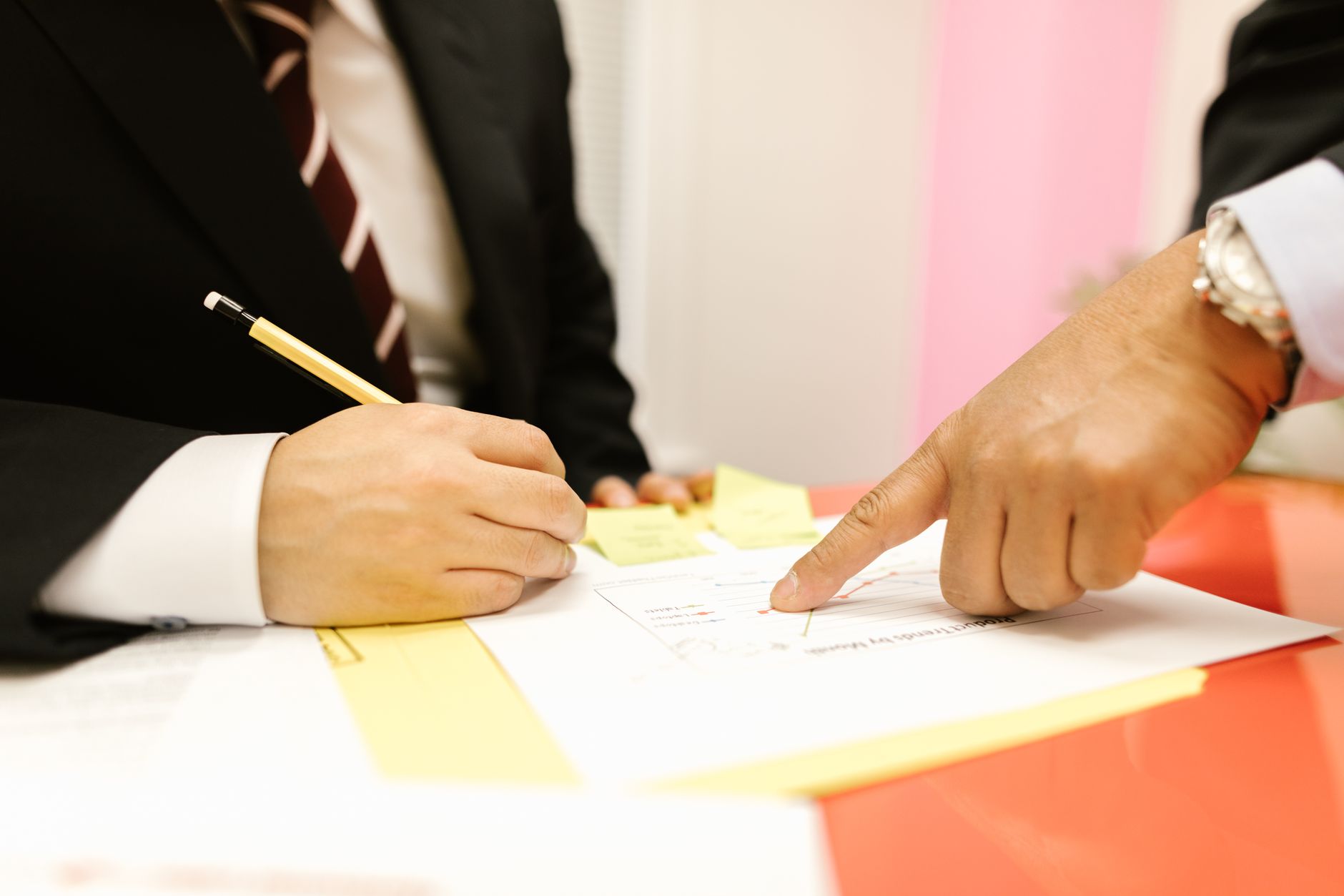 close up shot of a person writing on a paper